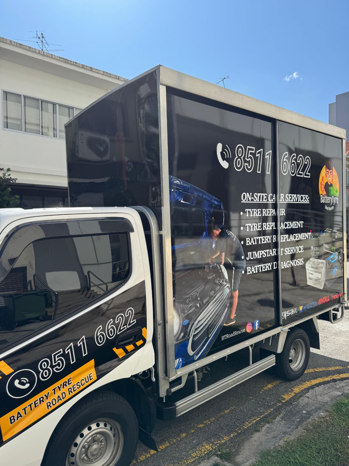 Roadside car service vehicle with tire repair equipment.